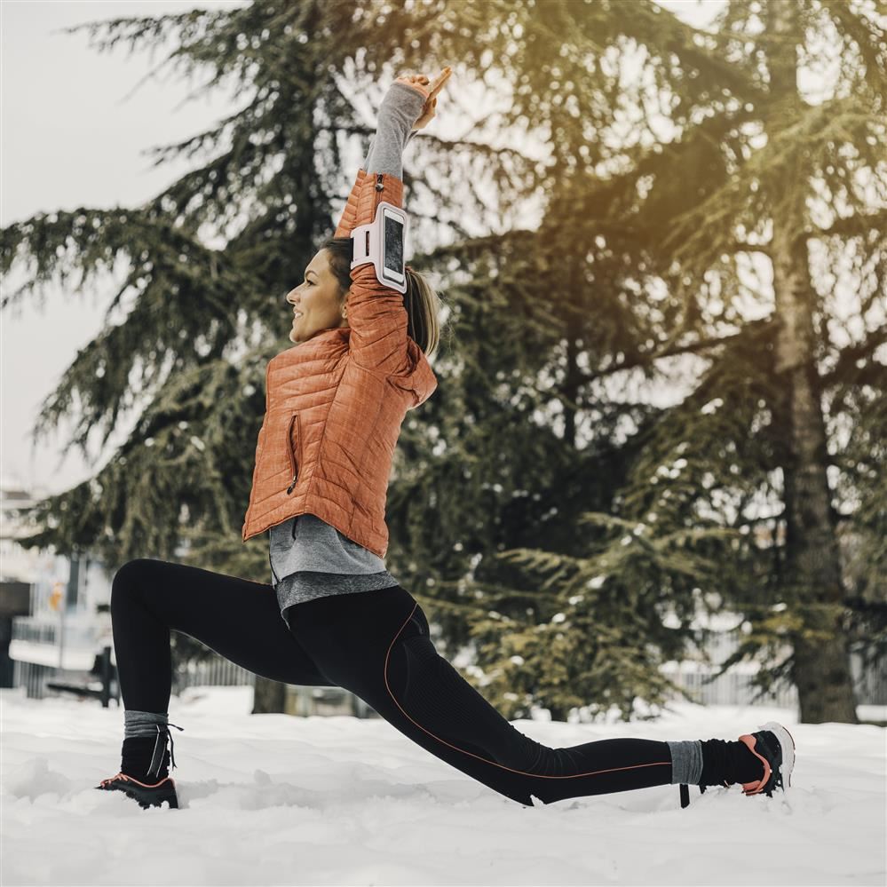  Woman exercising outside in the snow